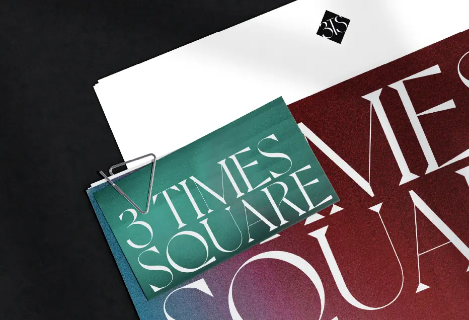 A stack of papers with "3 TIMES SQUARE" written in bold on one of them, clipped together.